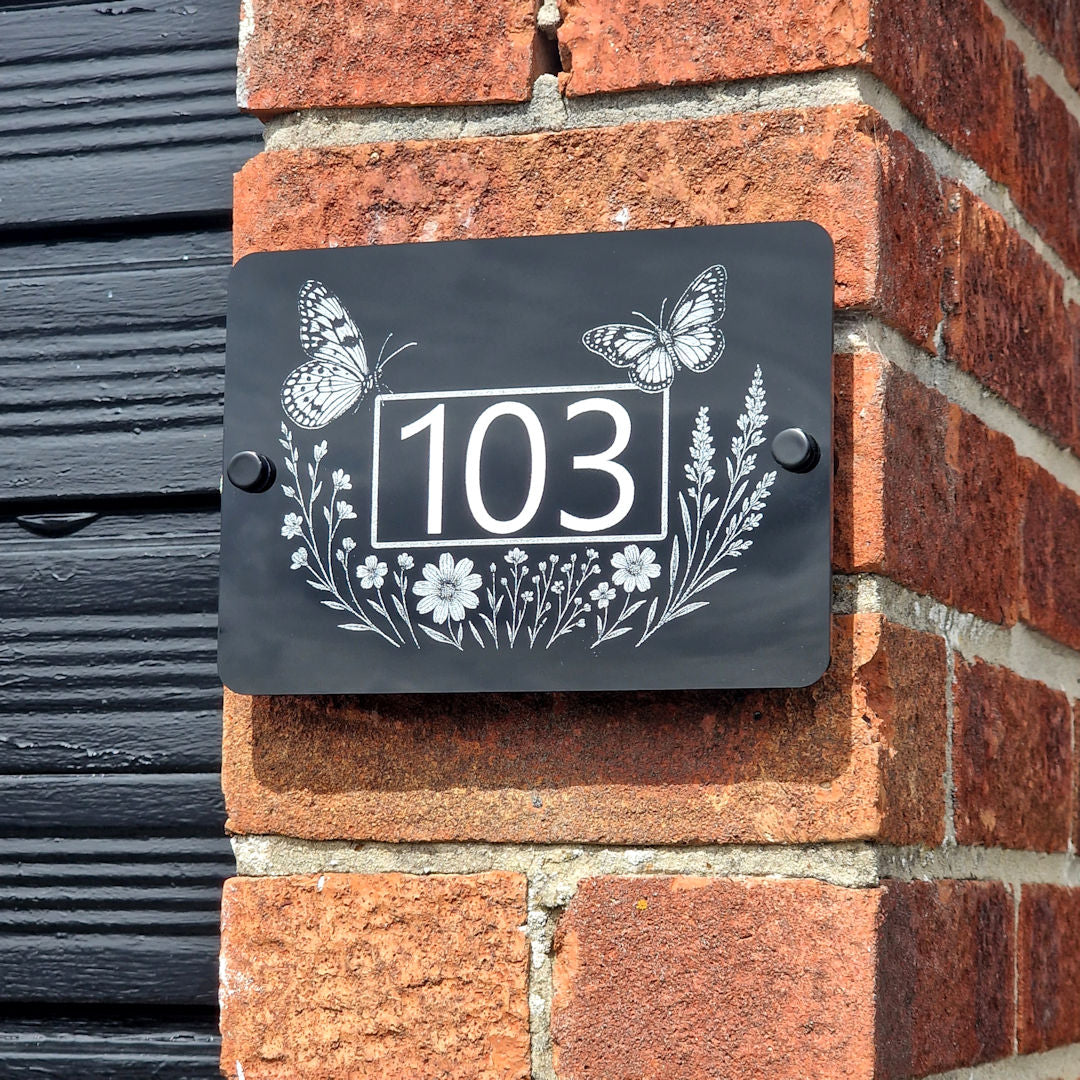 Engraved_Butterfly_Wildflower_House_Sign_On_Garage_Wall_Close_Up