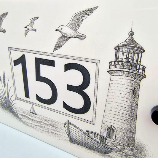 Coastal Lighthouse and Fishing Boat House Number Sign – Laser Engraved into White Acrylic - Close up
