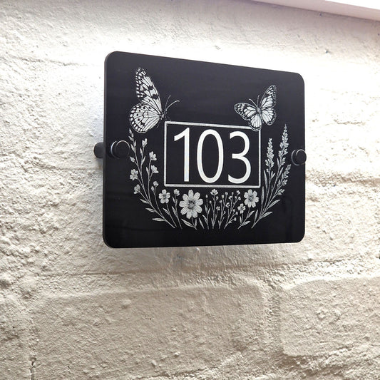 Engraved Butterfly & Wildflower House Number Sign – Black Acrylic with Stand-Offs - Left Angled View