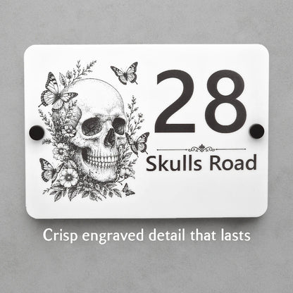 Close-up of the personalised Skull & Butterfly house sign showing crisp laser engraved details on white acrylic.