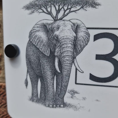 Laser engraved house number sign video panning around door sign to show engraved details