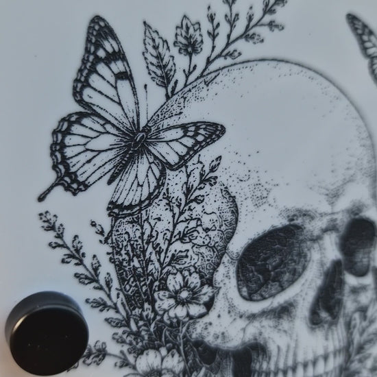 Video of the personalised Skull & Butterfly house sign installed on a brick wall, showcasing the engraved details and premium finish.
