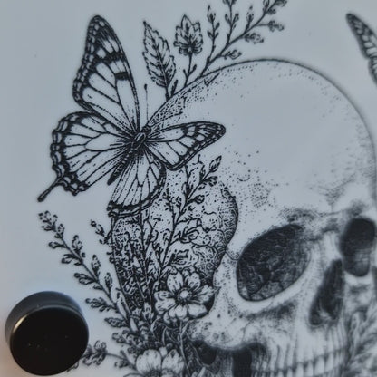 Video of the personalised Skull & Butterfly house sign installed on a brick wall, showcasing the engraved details and premium finish.
